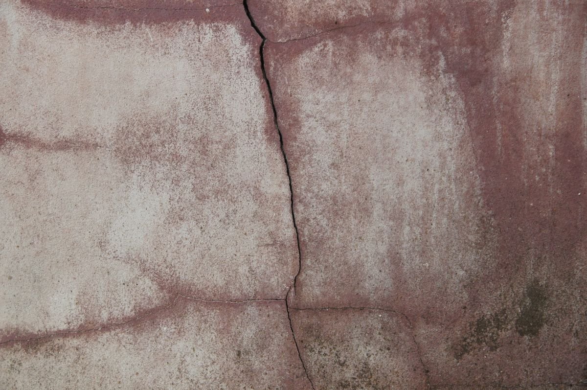 Cracked concrete foundation wall before epoxy injection repair
